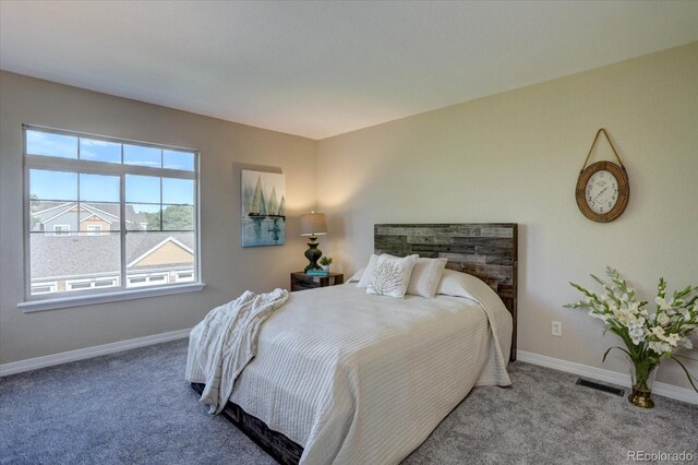 12812 Jasmine St Unit D, Thornton, CO 80602 - carpeted bedroom featuring baseboards