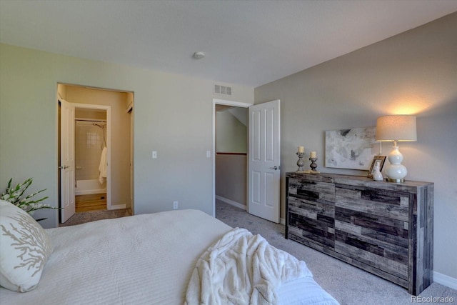 12812 Jasmine St Unit D, Thornton, CO 80602 - carpeted bedroom with baseboards and ensuite bathroom