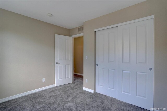 12812 Jasmine St Unit D, Thornton, CO 80602 - unfurnished bedroom featuring carpet flooring and a closet