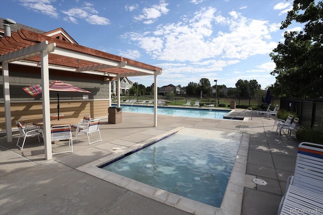 12812 Jasmine St Unit D, Thornton, CO 80602 - community pool featuring a pergola, a patio area, and a hot tub