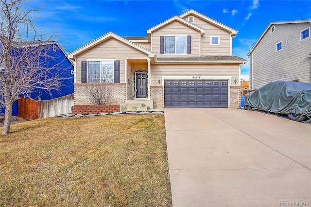 view of front of house featuring a front yard and a garage