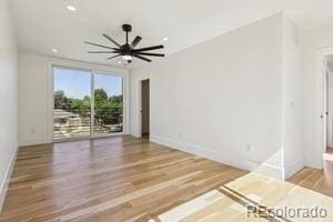 2620 N Perry St, Denver, CO 80212 - unfurnished living room with wood finished floors, ceiling fan, and recessed lighting
