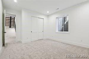 2620 N Perry St, Denver, CO 80212 - unfurnished bedroom with carpet flooring, a closet, and recessed lighting