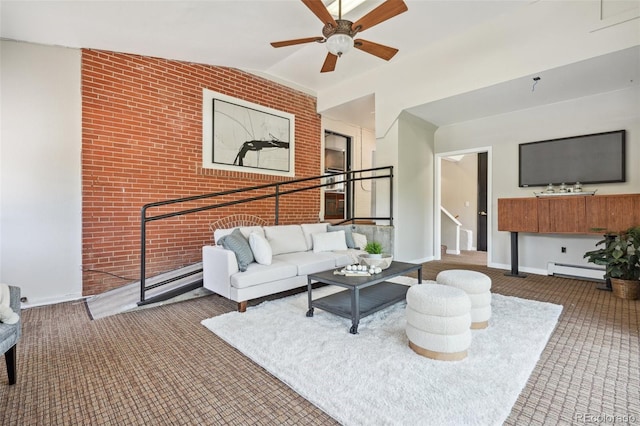 carpeted living room featuring brick wall, baseboard heating, lofted ceiling, and ceiling fan