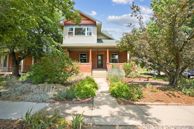 victorian house featuring a porch