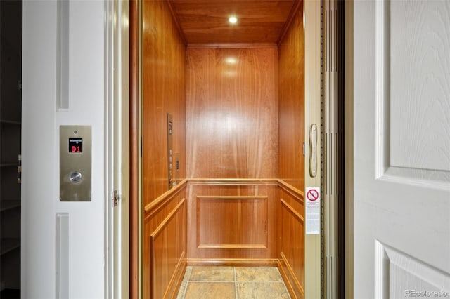 room details with tile patterned floors and elevator