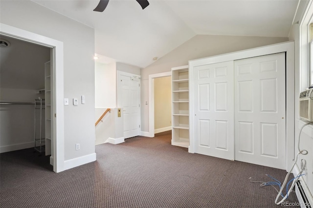 unfurnished bedroom featuring carpet, ceiling fan, and vaulted ceiling