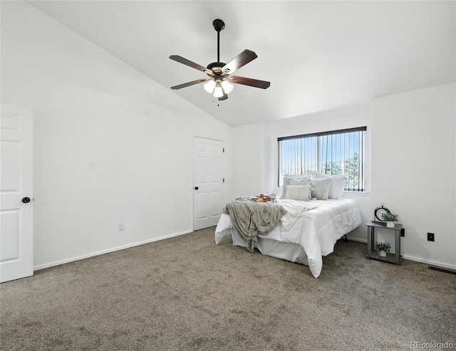 carpeted bedroom featuring lofted ceiling and a ceiling fan