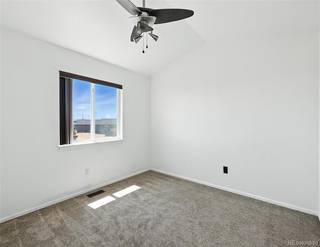 spare room featuring a ceiling fan and carpet floors