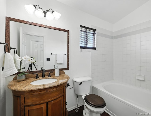 bathroom featuring toilet and vanity