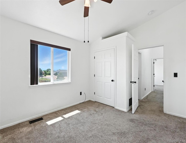 unfurnished bedroom featuring carpet floors and ceiling fan