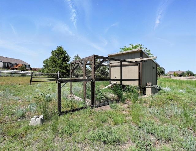 view of yard with an outdoor structure and exterior structure