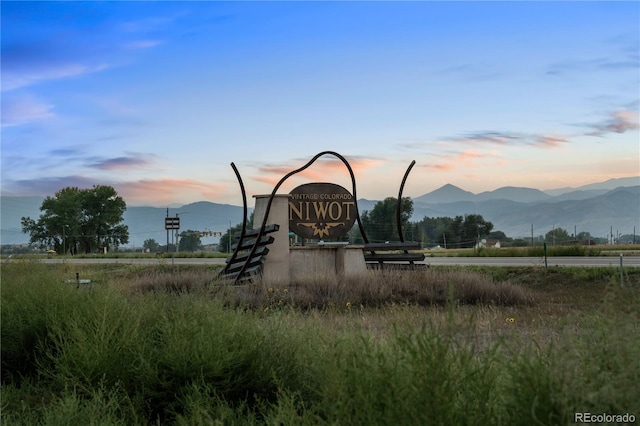 playground at dusk featuring a mountain view