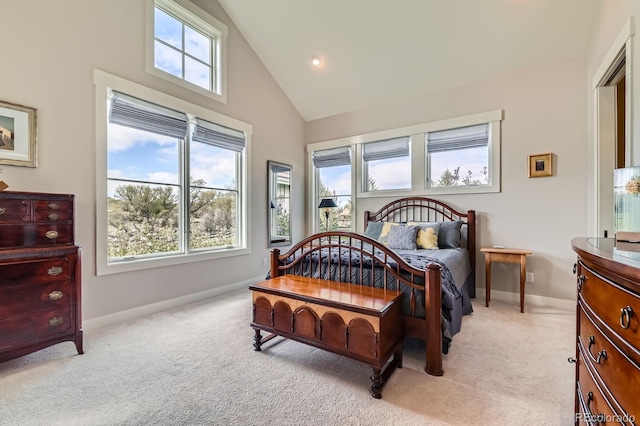 bedroom with baseboards, light carpet, and high vaulted ceiling