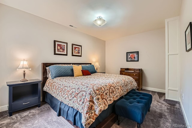 bedroom with carpet floors, baseboards, and visible vents