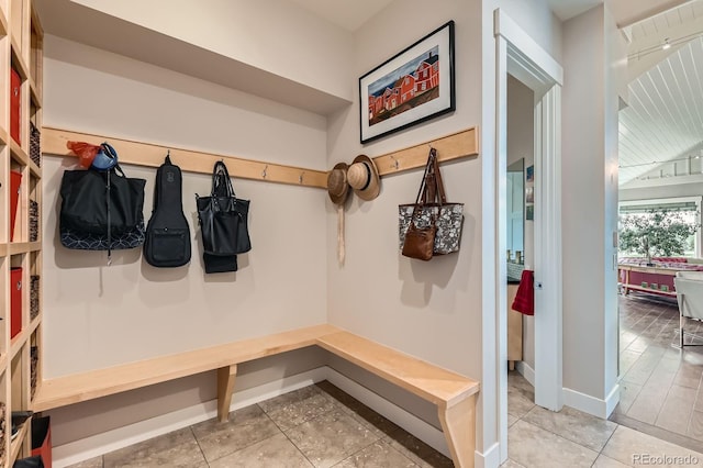 mudroom featuring baseboards and light tile patterned floors
