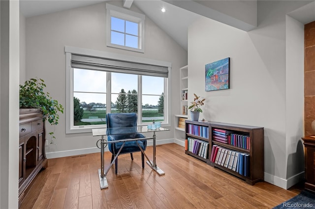 living area with visible vents, built in features, wood finished floors, baseboards, and recessed lighting