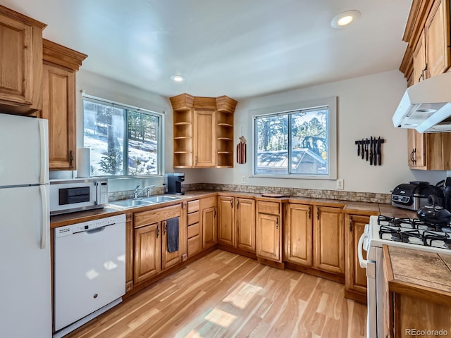 kitchen with light wood-style flooring, a sink, open shelves, recessed lighting, and white appliances