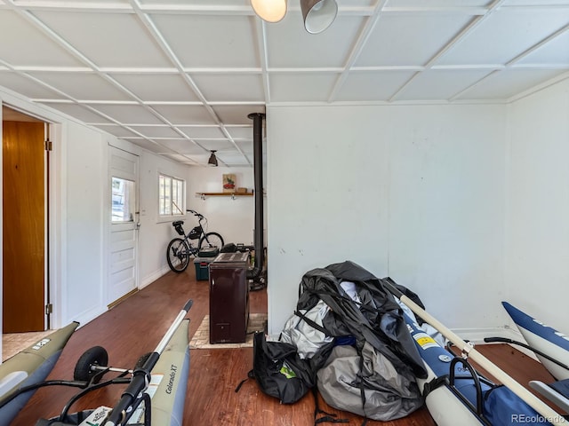 basement featuring baseboards and wood finished floors