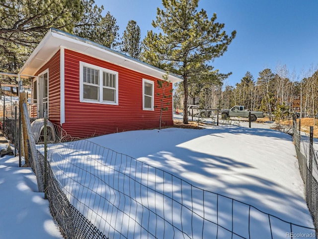 view of side of property with fence