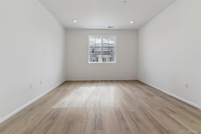 spare room with light wood-type flooring