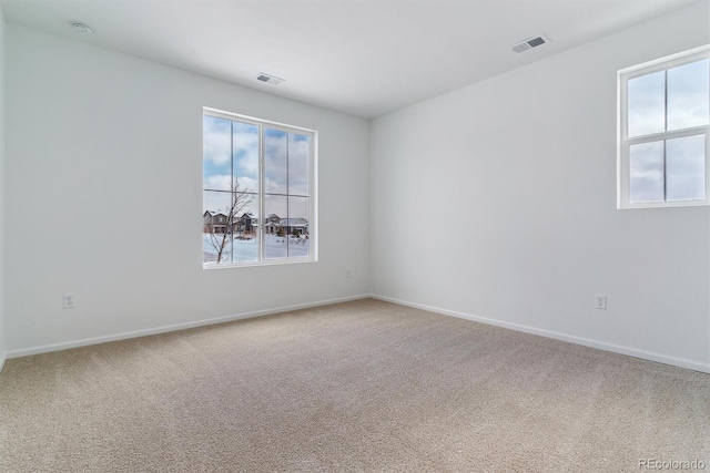 unfurnished room featuring carpet floors