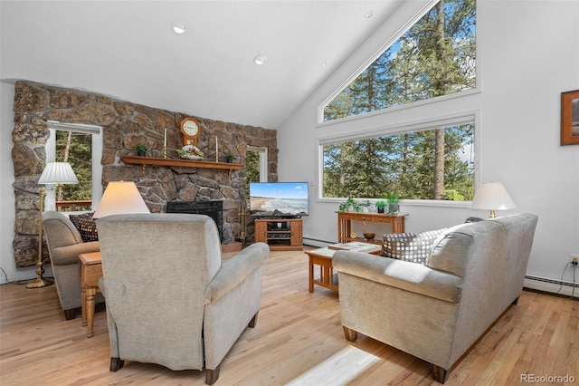 649 Cottonwood Dr, Evergreen, CO 80439 - living room with light wood-style flooring, high vaulted ceiling, a stone fireplace, baseboard heating, and recessed lighting