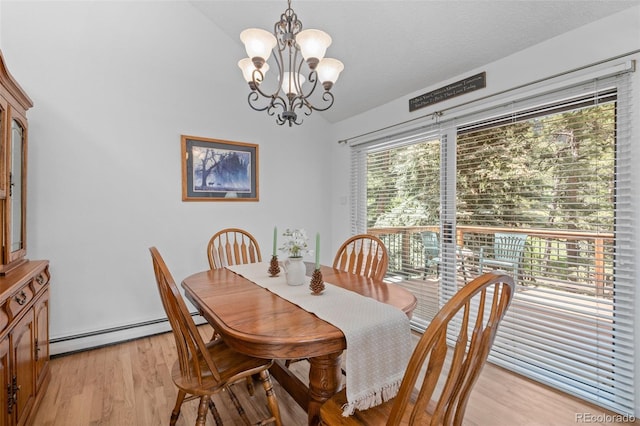 649 Cottonwood Dr, Evergreen, CO 80439 - dining space with a baseboard radiator, vaulted ceiling, a chandelier, and light wood finished floors