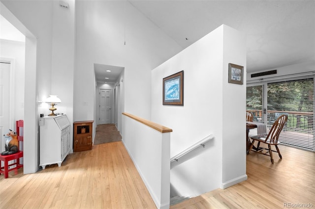 649 Cottonwood Dr, Evergreen, CO 80439 - corridor with an upstairs landing, light wood finished floors, and a towering ceiling