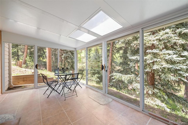 649 Cottonwood Dr, Evergreen, CO 80439 - sunroom featuring plenty of natural light, tile patterned flooring, floor to ceiling windows, and outdoor dining space