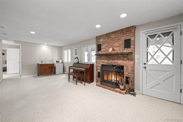 649 Cottonwood Dr, Evergreen, CO 80439 - living area with a textured ceiling, light carpet, a fireplace, recessed lighting, and bar area