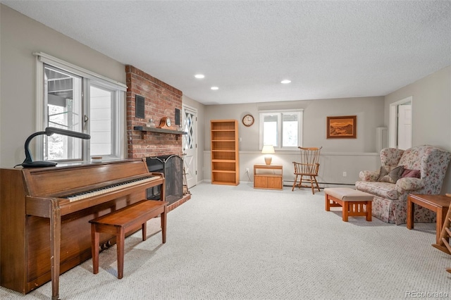 649 Cottonwood Dr, Evergreen, CO 80439 - living room featuring light carpet, a fireplace, baseboard heating, a textured ceiling, and recessed lighting