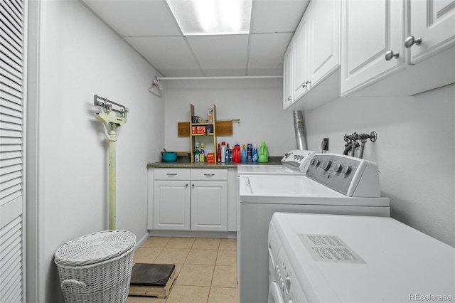 649 Cottonwood Dr, Evergreen, CO 80439 - laundry room with cabinet space, washer and dryer, and light tile patterned floors