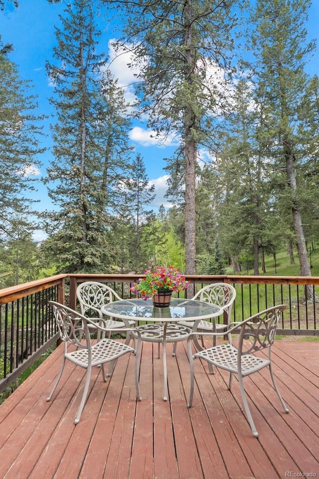 649 Cottonwood Dr, Evergreen, CO 80439 - wooden deck with outdoor dining area