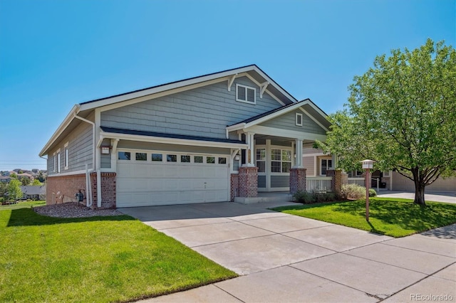 craftsman-style home featuring brick siding, a porch, and a front lawn