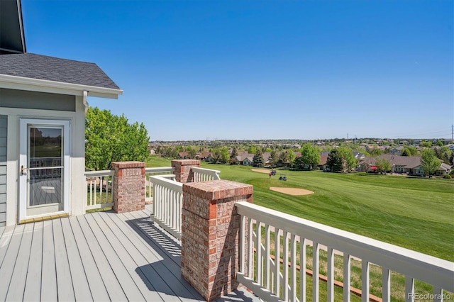 wooden terrace with view of golf course, a residential view, and a yard
