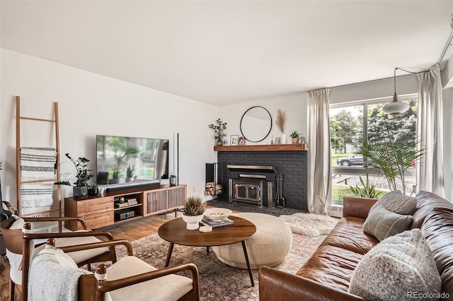 7491 W 45th Ave, Wheat Ridge, CO 80033 - living area with a brick fireplace and wood finished floors
