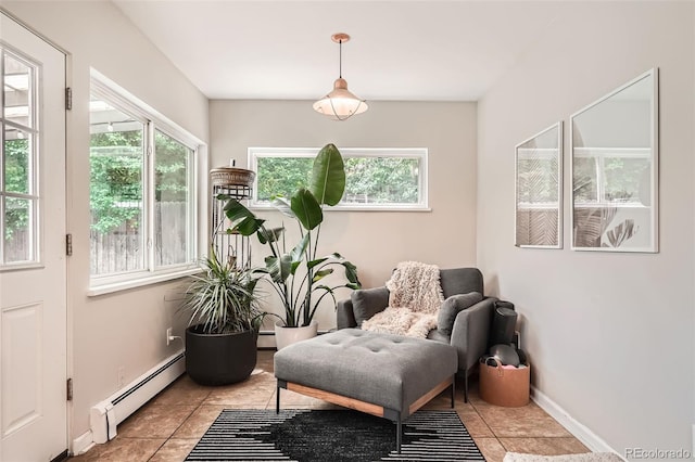 7491 W 45th Ave, Wheat Ridge, CO 80033 - living area featuring baseboard heating and light tile patterned floors