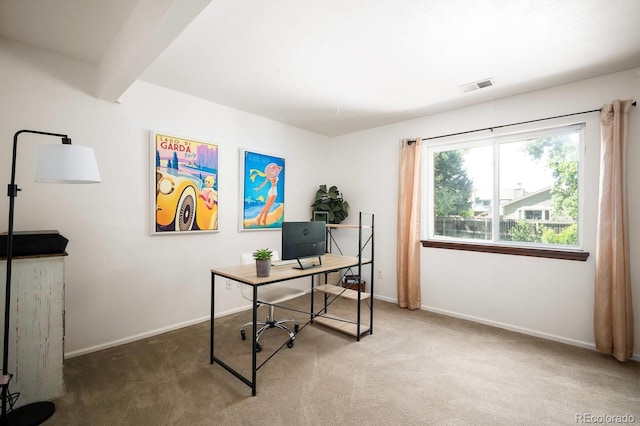 carpeted office with beam ceiling, visible vents, and baseboards