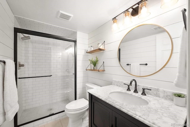 bathroom featuring a stall shower, visible vents, vanity, and toilet