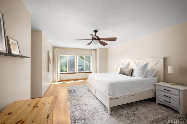 bedroom featuring a ceiling fan and light wood-type flooring