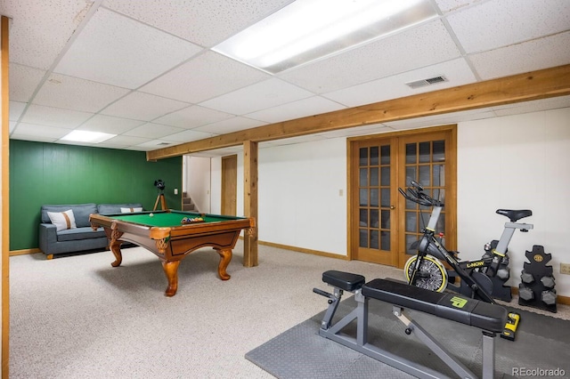 playroom featuring baseboards, visible vents, a drop ceiling, french doors, and carpet floors