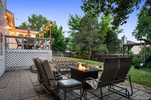 view of patio / terrace with an outdoor fire pit and a fenced backyard