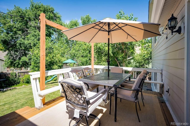 view of patio / terrace with outdoor dining area and a deck