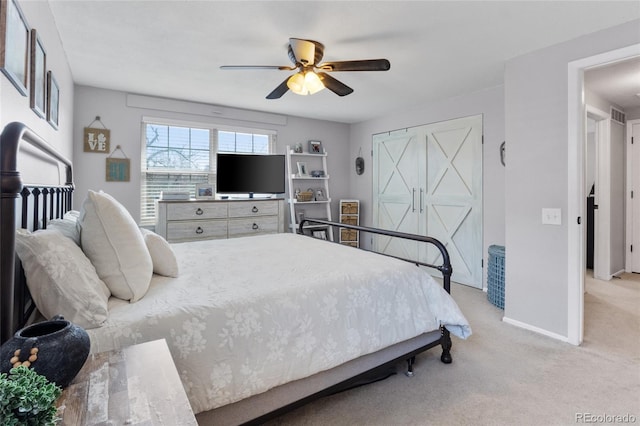 bedroom featuring light carpet, ceiling fan, and baseboards