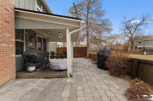 view of patio with a fenced backyard and area for grilling