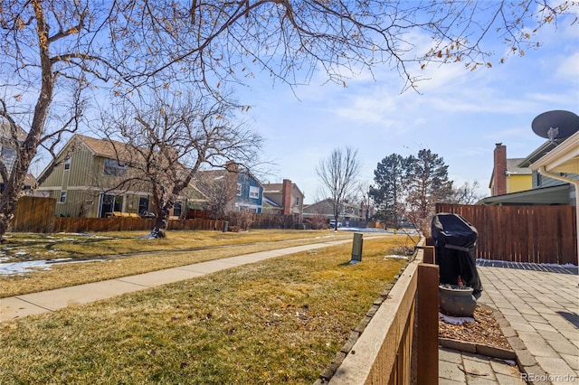 exterior space with fence and a residential view