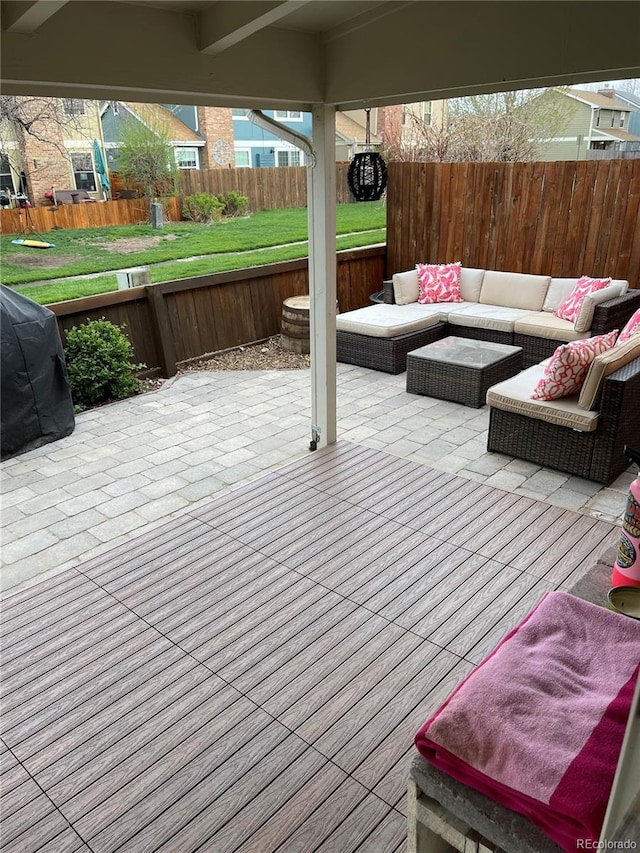 deck with a patio area, a fenced backyard, and outdoor lounge area