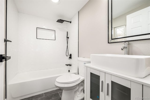 full bathroom featuring tile patterned flooring, vanity, toilet, and tiled shower / bath