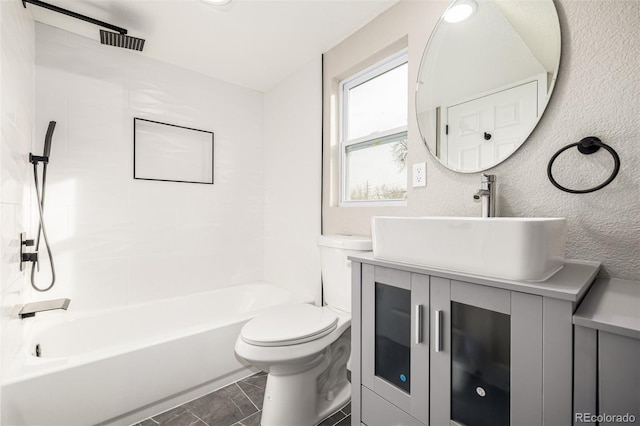 full bathroom featuring vanity, shower / bath combination, and toilet